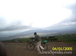 Kenyan man pushes bike