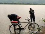 Man washes bicycle