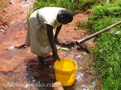 Woman from Shikunga Village collects water