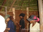 Building the mud wall of the hut