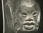 Face of Afro-Olmec child carved on the waist "belt" of an Olmec ballplayer