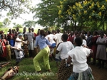 Renee dances with some of the villagers
