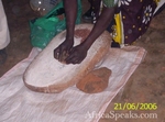 Making millet flour using a grinding stone